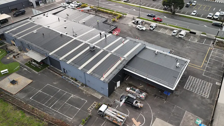 Second Dulux Topcoat applied during commercial roof painting for maximum rust protection