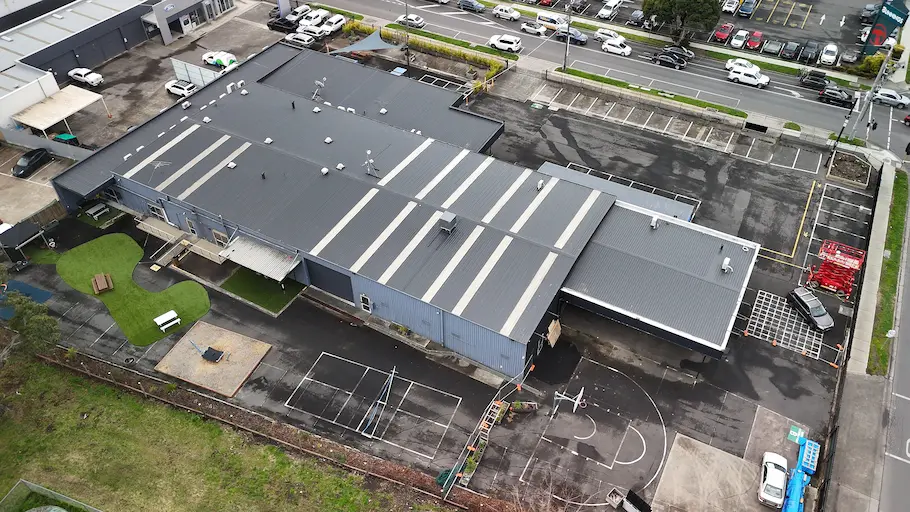 Completed commercial roof restoration with Dulux topcoat and Noxyde waterproofing