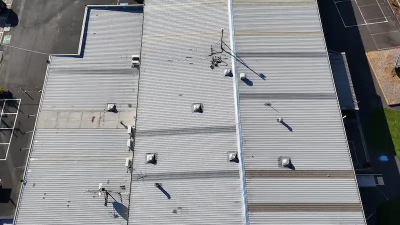Lilydale School roof showing water and rust damage before restoration