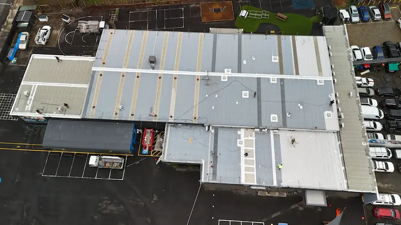 Commercial painting with Noxyde Anti-Corrosion Waterproofing Membrane for maximum roof protection.