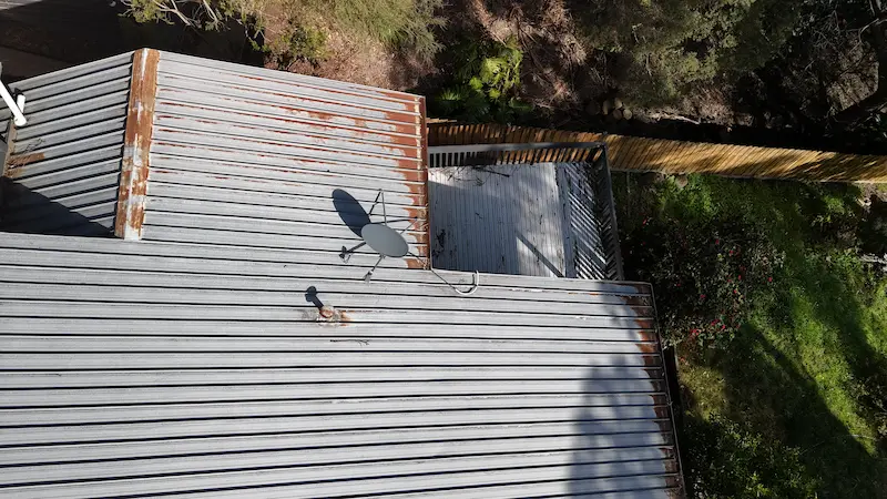 Upper Pakenham metal roof with minor leaks and surface rust before Noxyde rust and water ingress treatment