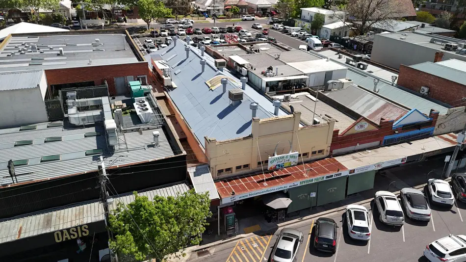Aerial view of newly restored Fairfield commercial roof with full Noxyde membrane applied