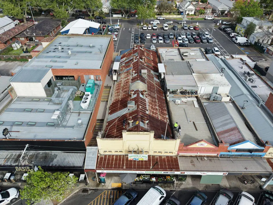 Aerial view of heavily rusted commercial roof in Fairfield before Noxyde restoration