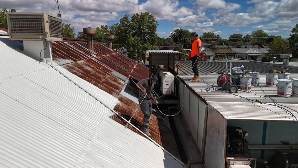 MPC team preparing Fairfield commercial roof with pressure washing
