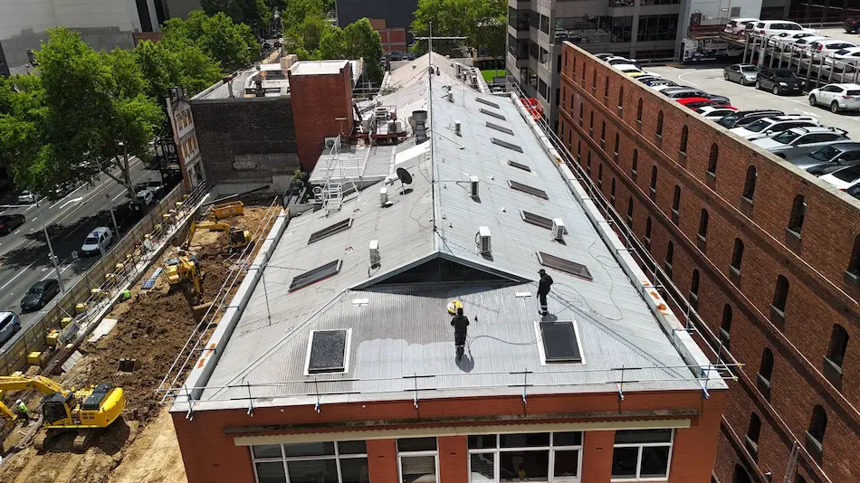 Aerial view of Melbourne CBD roof during waterproofing membrane works