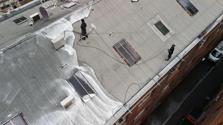 Roof membrane application underway on Melbourne CBD body corporate building