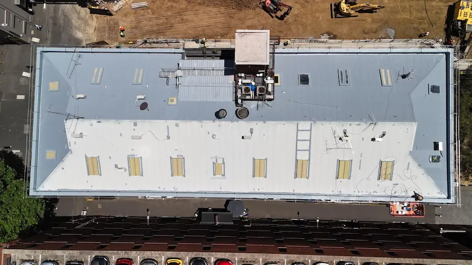 Top coat waterproofing membrane application on Melbourne CBD commercial roof