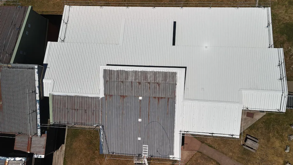 Noxyde waterproofing membrane applied to metal roof in Falls Creek