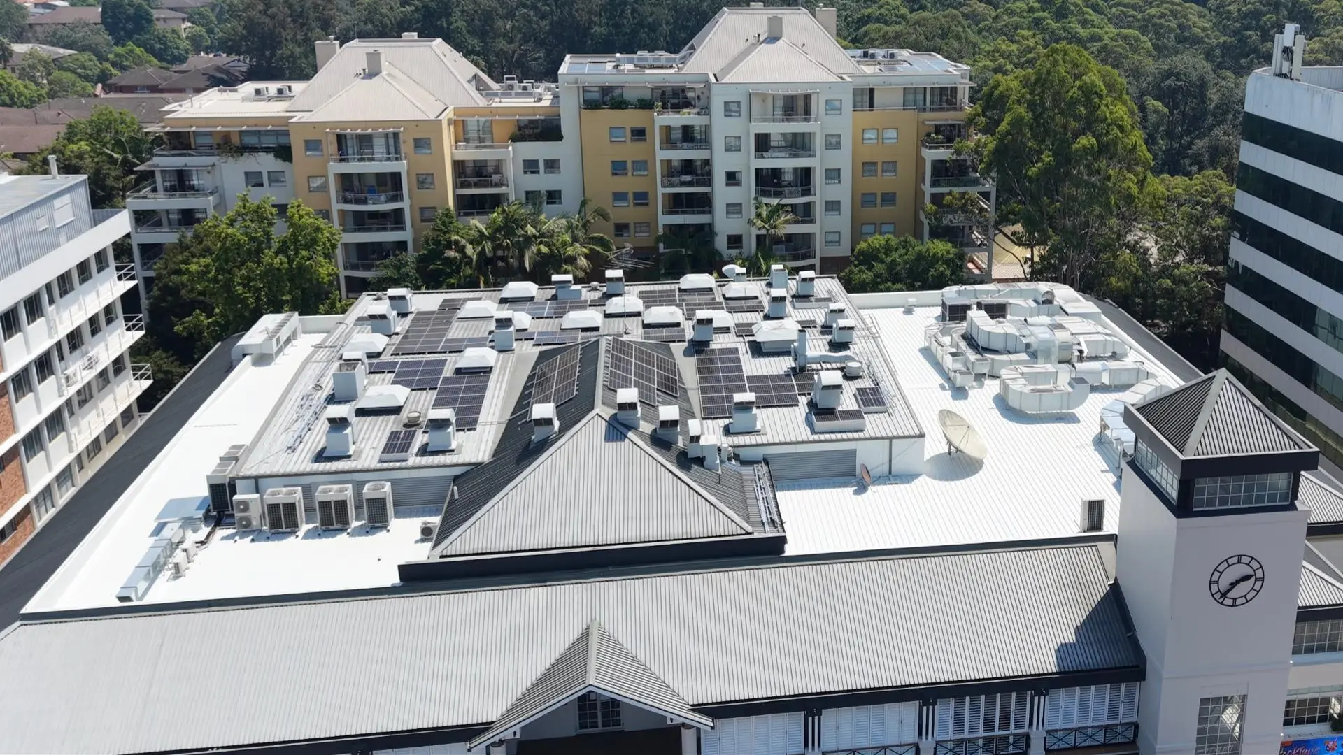 Finished commercial roof waterproofing system protecting plant equipment and solar panels