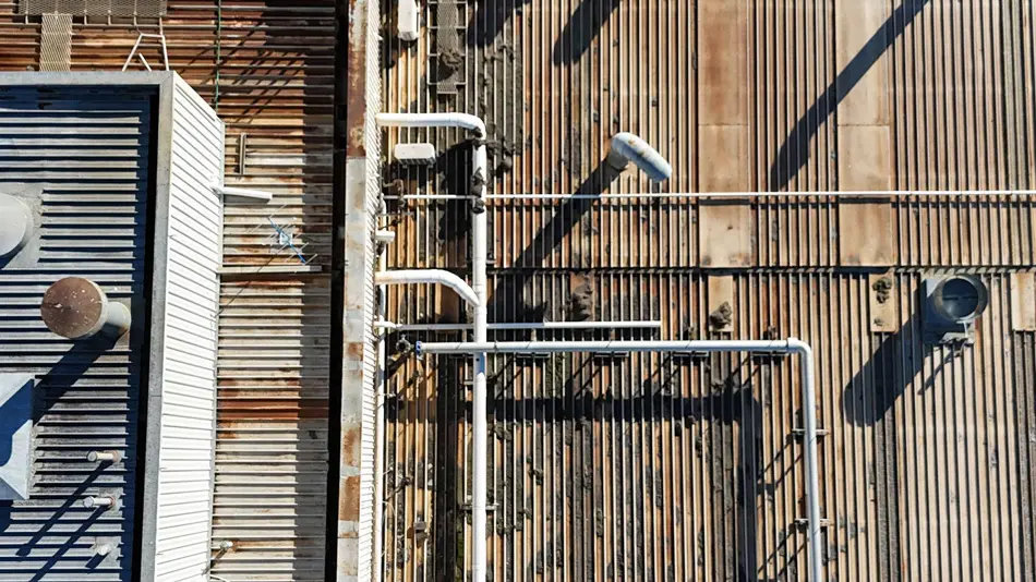 Rusted commercial roof at Alsco Mulgrave before waterproofing and corrosion protection works
